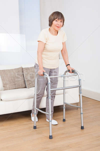 Senior Woman Using Walking Frame Stock photo © AndreyPopov