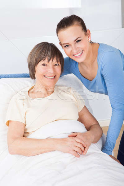 Portrait Of Happy Caregiver With Senior Woman Stock photo © AndreyPopov