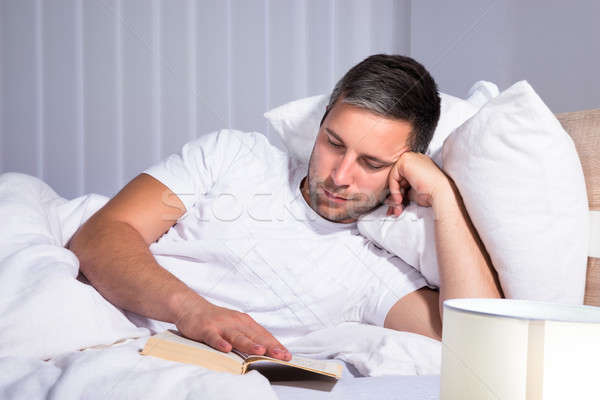 Man Reading Book While Relaxing Stock photo © AndreyPopov