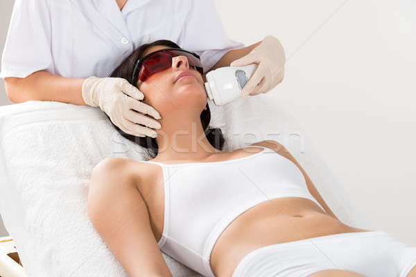 Beautician Giving Epilation Laser Treatment Stock photo © AndreyPopov