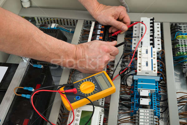 Electrician Checking A Fuse Box Stock photo © AndreyPopov