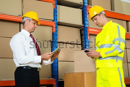 Worker Sealing Cardboard Box With Adhesive Tape Stock photo © AndreyPopov