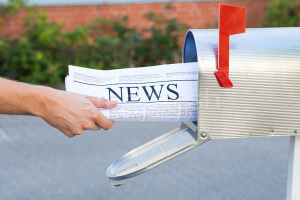 Person Hands Opening Mailbox To Remove Newspaper Stock photo © AndreyPopov