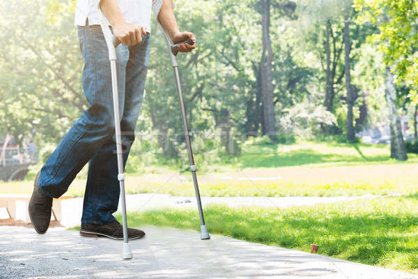 Man Walking With Crutches Stock photo © AndreyPopov