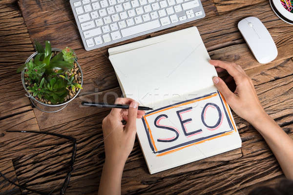 Businessperson Writing Search Engine Optimization Concept Stock photo © AndreyPopov