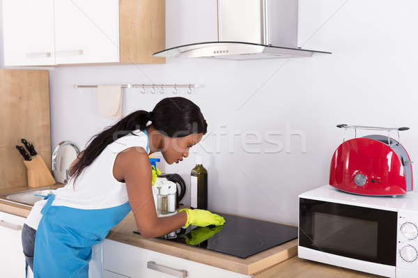 Housewife Cleaning Induction Stove Stock photo © AndreyPopov