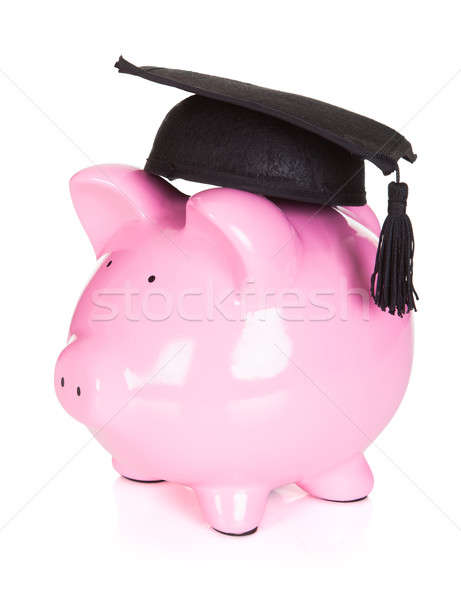 Stock photo: Piggybank wearing graduation hat