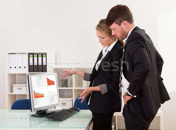 Business colleagues discussing statistics Stock photo © AndreyPopov