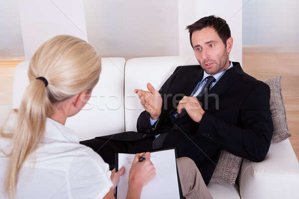 Uomo parlando psichiatra spalla view uomo d'affari Foto d'archivio © AndreyPopov