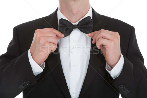 Midsection Of Waiter Adjusting Bowtie Stock photo © AndreyPopov