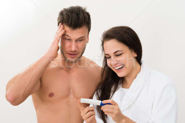 Young Couple Looking At Pregnancy Test Stock photo © AndreyPopov