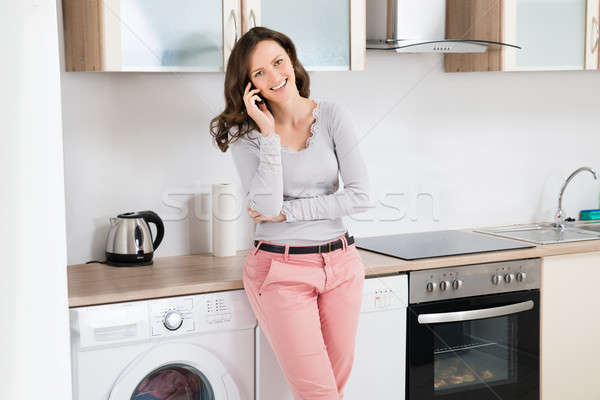 Woman Talking On Mobile Phone Stock photo © AndreyPopov