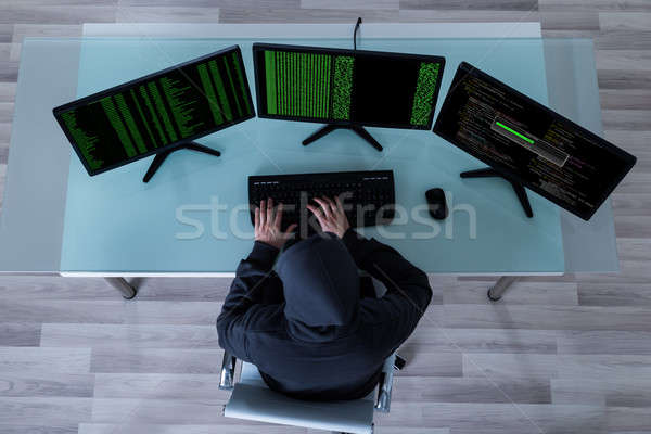 Hacker lop információ többszörös számítógépek magasról fotózva Stock fotó © AndreyPopov