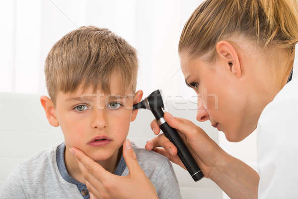 Doctor Examining Boy's Ear Stock photo © AndreyPopov