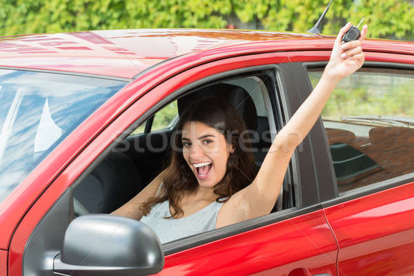 Excited Woman Sitting Inside Car Stock photo © AndreyPopov