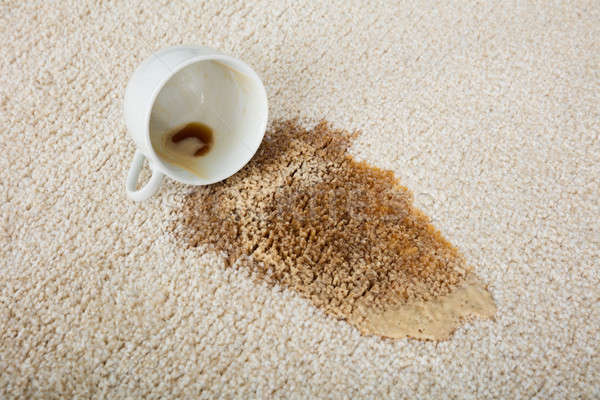 Coffee Spilling From Cup On Carpet Stock photo © AndreyPopov