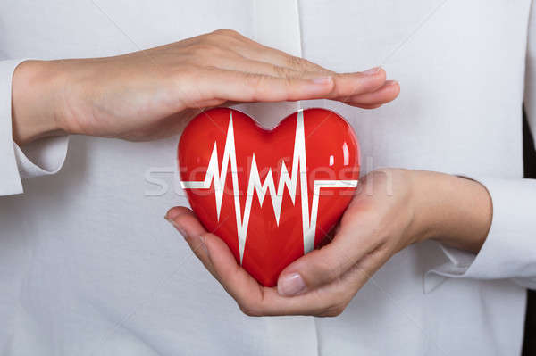 Person Protecting Heart Stock photo © AndreyPopov