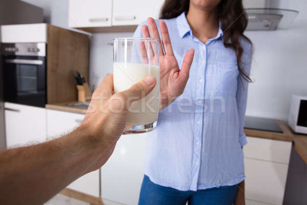 Woman Rejecting Glass Of Milk Stock photo © AndreyPopov