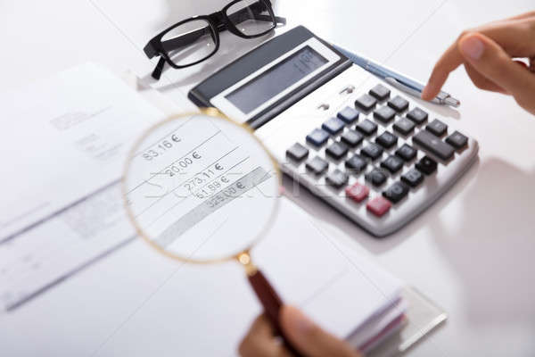 Businesswoman Analyzing Invoice Stock photo © AndreyPopov