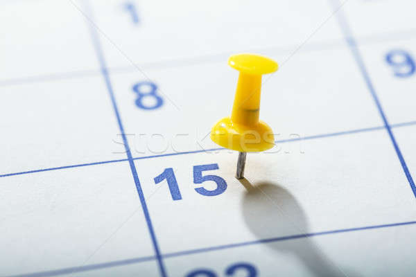 Yellow Thumbtack Stuck On Calendar Stock photo © AndreyPopov