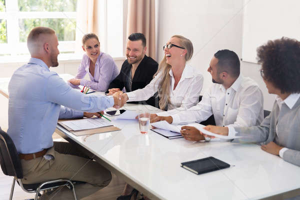 Businessman Shaking Hands At Interview Stock photo © AndreyPopov