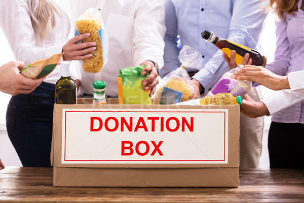 Group Of People Donating Food Stock photo © AndreyPopov