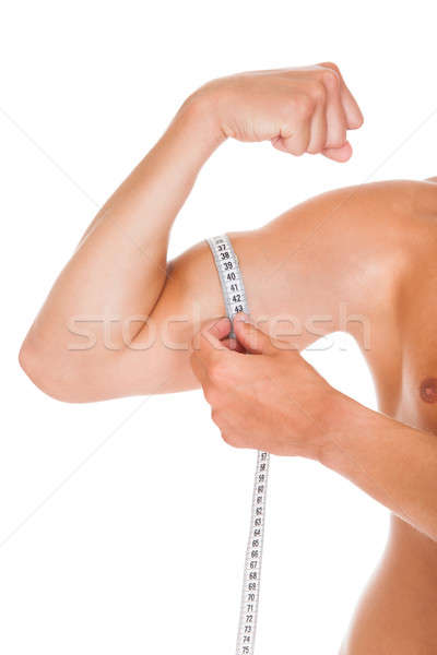 Man Measuring His Biceps Stock photo © AndreyPopov