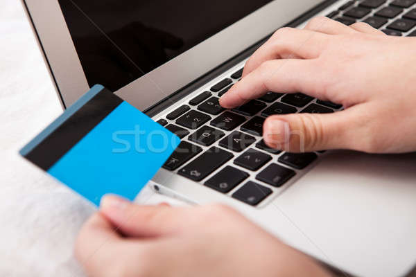 Person Using Credit Card For Online Shopping Stock photo © AndreyPopov