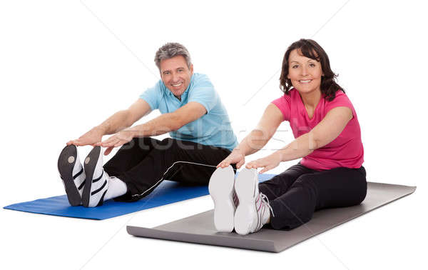 Active mature couple doing fitness Stock photo © AndreyPopov