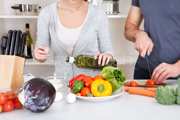 Adding olive oil while cooking salad Stock photo © AndreyPopov