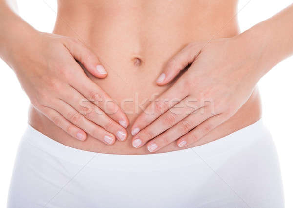 Kobieta cierpienie ból brzucha młoda kobieta ból żołądka Zdjęcia stock © AndreyPopov