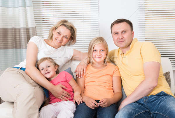 Happy Family Sitting On Sofa Stock Photo C Andriy Popov Andreypopov Stockfresh