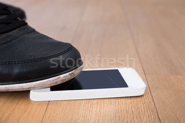 Foot On Cellphone Stock photo © AndreyPopov