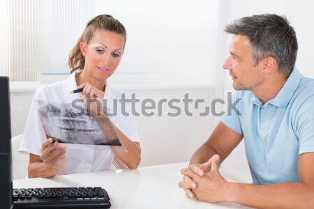 Doctor Checking Blood Sugar Level Of Patient Stock photo © AndreyPopov