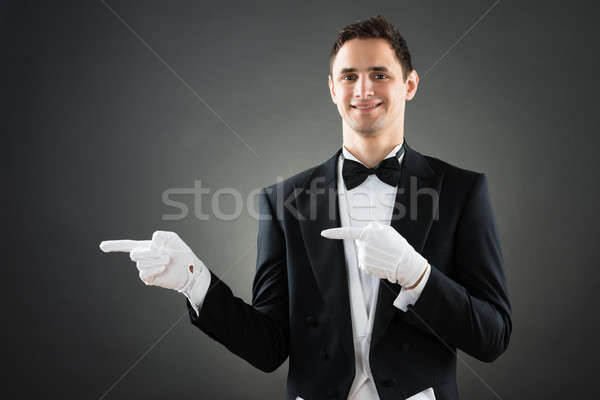 Confident Waiter Presenting Invisible Product Stock photo © AndreyPopov