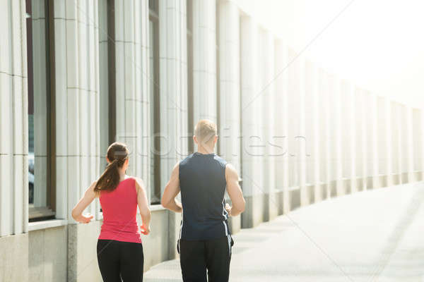 Young Couple Running Together Stock photo © AndreyPopov
