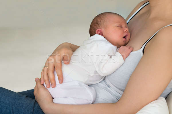 Mother Holding Her Sleeping Baby Stock photo © AndreyPopov