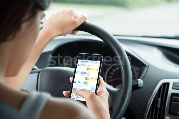 Közelkép nő gépel szöveges üzenet mobiltelefon ül Stock fotó © AndreyPopov