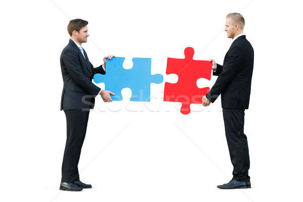 Two Businessmen Solving Jigsaw Puzzle Stock photo © AndreyPopov