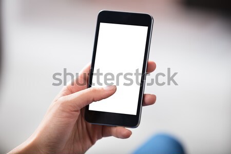 Hands Holding Cell Phone With Blank Screen Stock photo © AndreyPopov