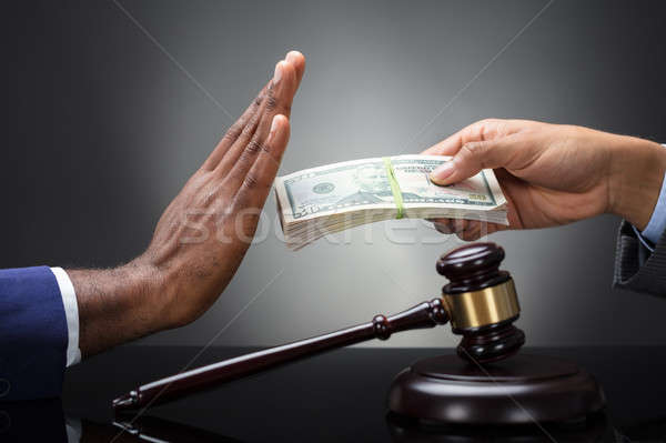 Close-up Of A Judge's Hand Refusing Bribe Stock photo © AndreyPopov