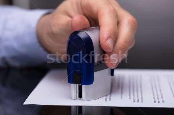 Businessperson Stamping Document Stock photo © AndreyPopov