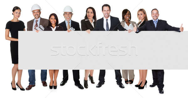 Group of business people presenting empty banner Stock photo © AndreyPopov