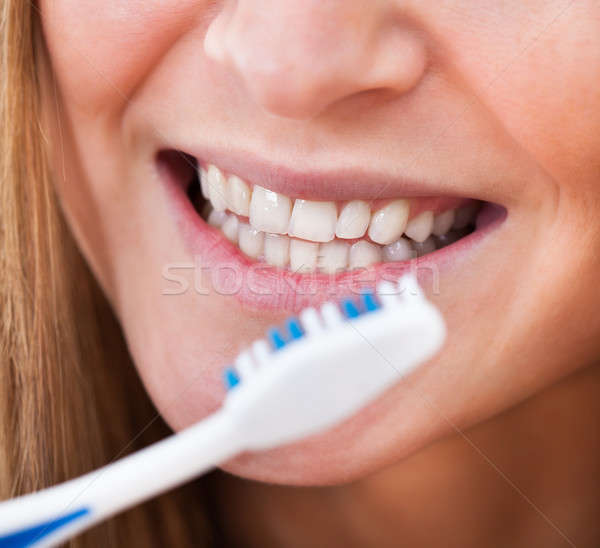 Woman Brushing Her Teeth Stock photo © AndreyPopov