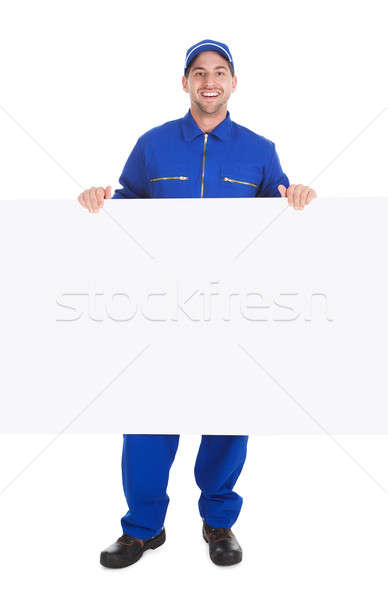 Smiling Manual Worker With Billboard Stock photo © AndreyPopov