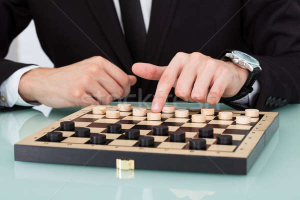 Businessman Playing Checkers Stock photo © AndreyPopov