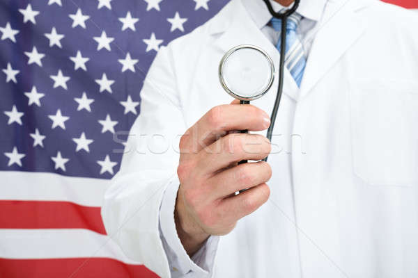 врач стетоскоп американский флаг человека работу Сток-фото © AndreyPopov