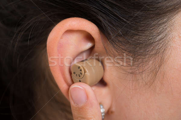 Woman Ear With Hearing Aid Stock photo © AndreyPopov