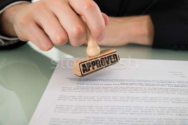 Businessman Hand Approving Document Stock photo © AndreyPopov