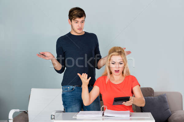 Shocked Couple Looking At Bill Stock photo © AndreyPopov